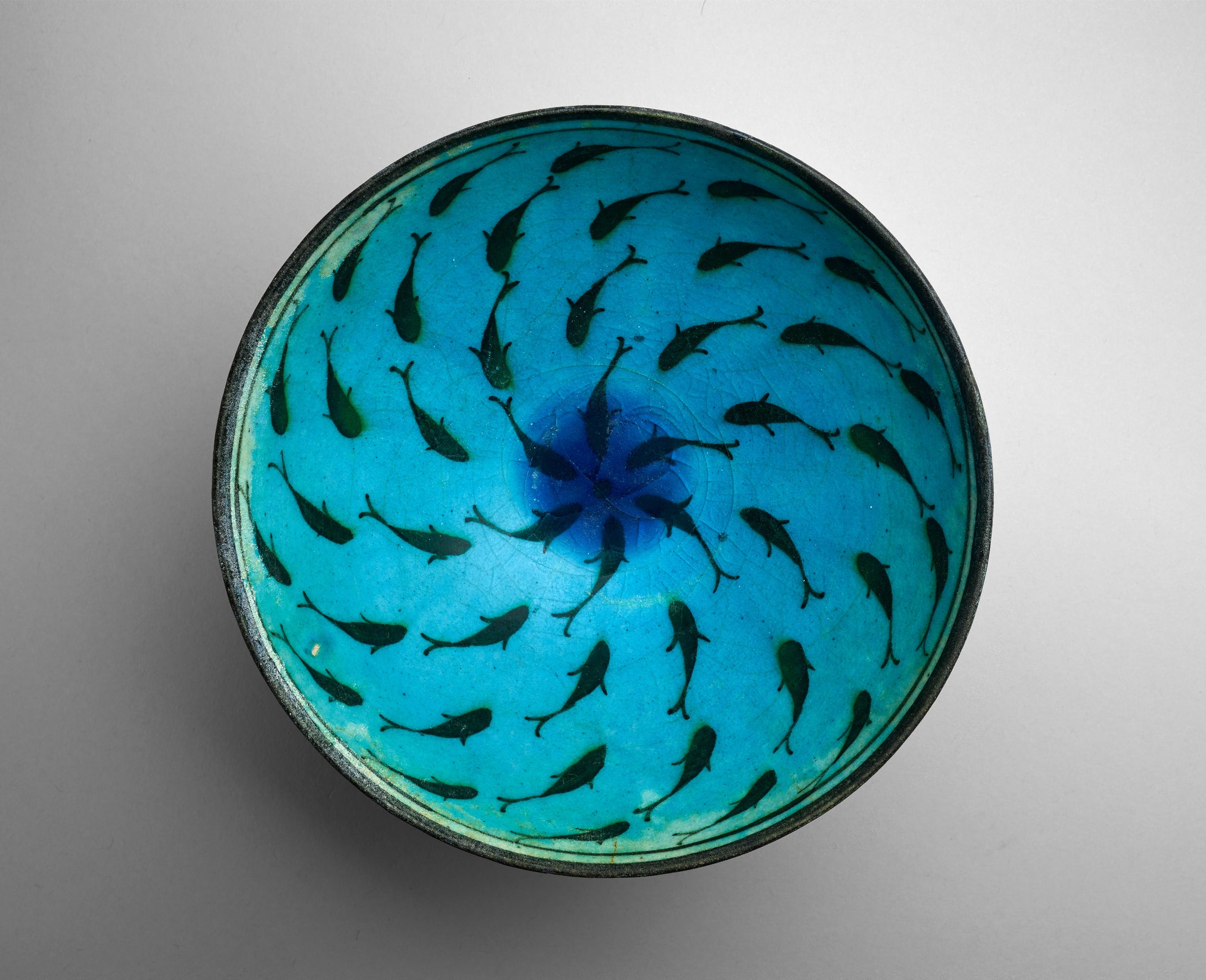 Bowl with Fish, late 13th–mid-14th century, stonepaste; painted in black under turquoise glaze, The Hossein Afshar Collection at the Museum of Fine Arts, Houston